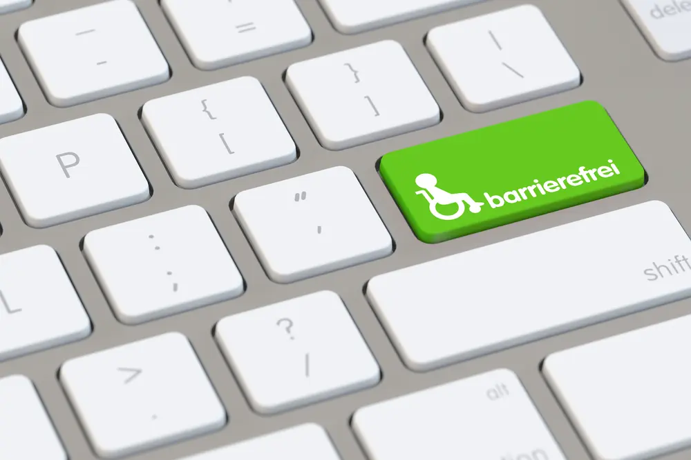 Tastatur mit einem grünen Button, auf dem ein Rollstuhl Symbol ist und 